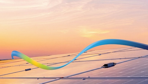 Photo of solar panels at sunset