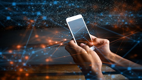 Image of two hands holding a mobile phone interwoven with fibre line graphics.