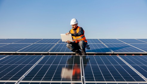 man working on solar farm