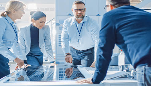 People working around table