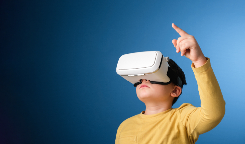 Child with a VR headset pointing to the sky