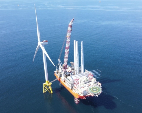 An offshore wind farm being constructed in the water.