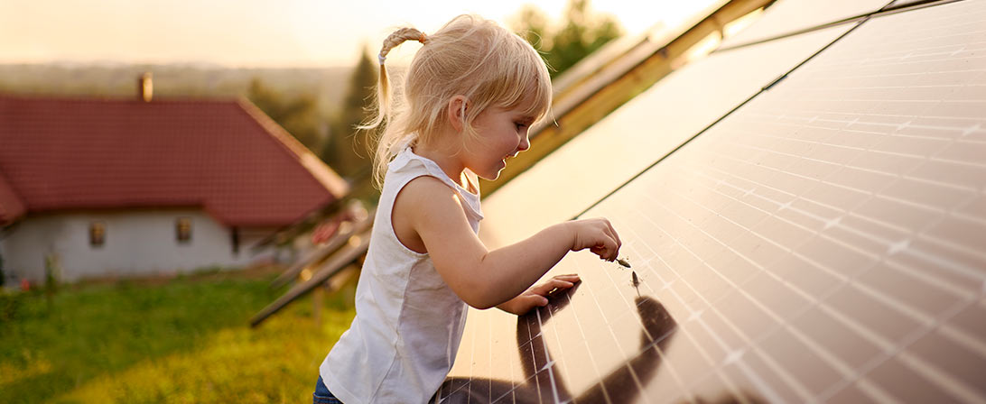 child at solar panel