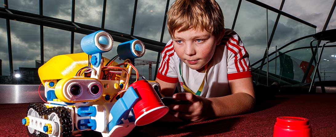 child playing with tech project