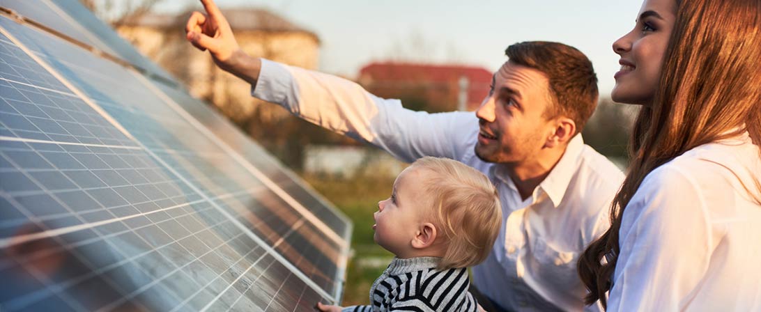 family at solar panel