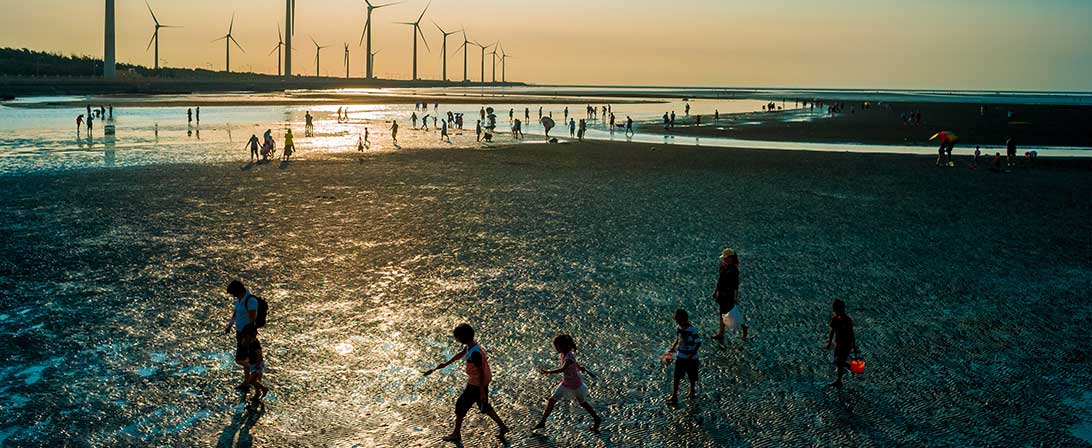 windmills and people on beach
