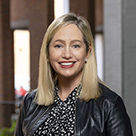 Aisling Curtis, white woman with long blonde hair wearing a black jacket and black shirt