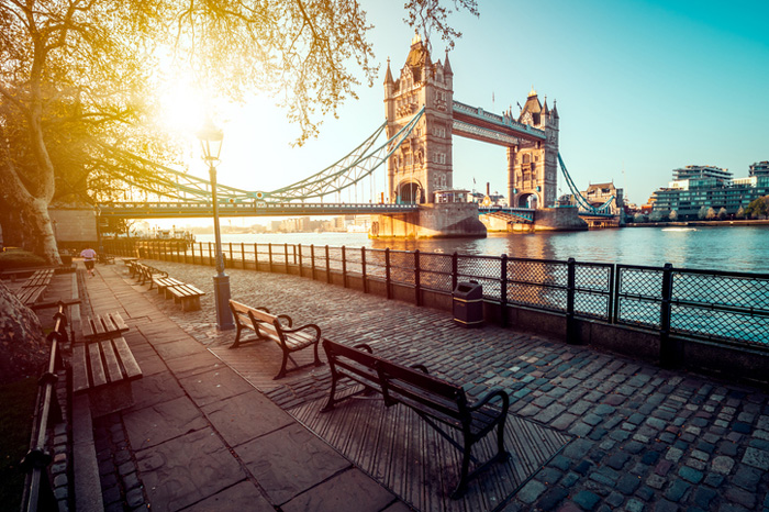 London Bridge at sunset with view of benches and river Thames