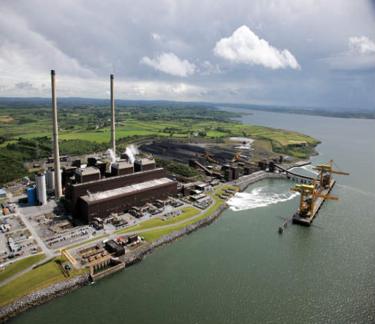 moneypoint-generation-station in Co Clare with two large stacks and a harbour