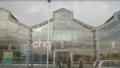 The CHQ building in Dublin with glass frontage.