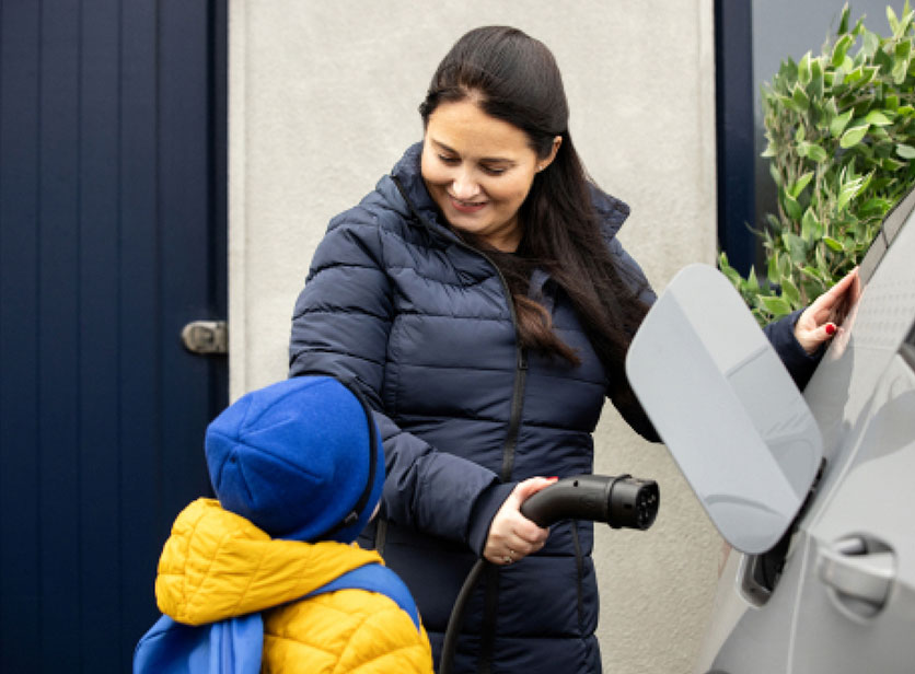 family-charging-car