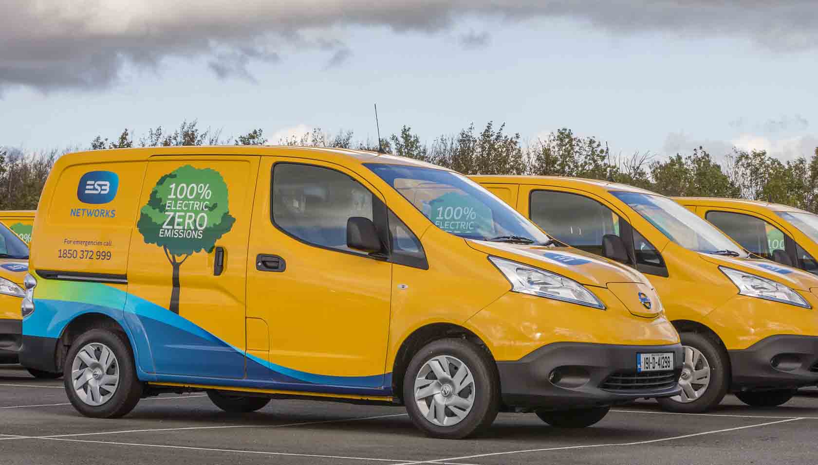 Picture of yellow ESB Networks fleet of vans with branding to the side